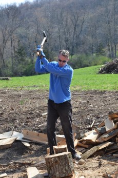 Splitting wood as people have done for hundreds of years.